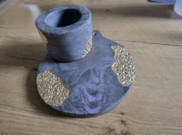 Set of round, textured coasters and tea light holders in a soft blue color.