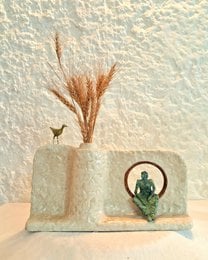 Sculptural papier-mache vase, beige cream color, geometric shape, decorative dried wheat grass, cactus motif, modern minimalist style.