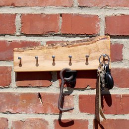 Key holder made of olive wood with bark