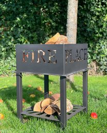 A rectangular metal fire pit with the word "FIRE" cut out on the sides, providing a rustic and functional design for outdoor gatherings. The fire pit features a lower shelf for storing firewood.
