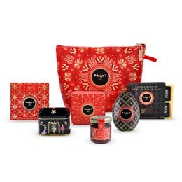 A luxurious chocolate gift set featuring a variety of premium chocolate products in a vibrant red and gold packaging design. Includes a selection of truffles, chocolate bars, and other confections.
