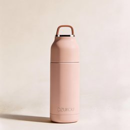Stainless steel vacuum insulated thermos flask in a pale pink color, with a sleek and modern design, suitable for hot and cold beverages.