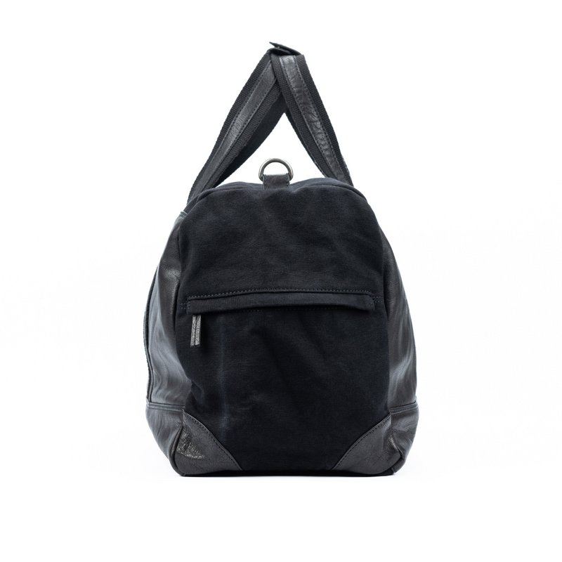 K0024AB | Rejsetaske i lærred/ægte læder, fuldnarvet, svinghjul - Farve Sort Tilbehør antik nikkel, lynlås. Mål: 48 x 31 x 22 cm - Emballage: Tnt taske