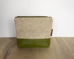 Green and beige toiletry bag made of woven material.