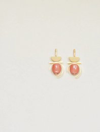 Statement earrings in a contrast of cream and mandarin colors with a modern, minimalist design.
