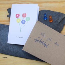 Colorful heart-shaped balloons on a greeting card, perfect for expressing love and affection.