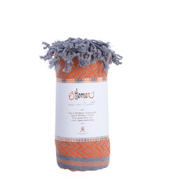Orange hammam towel with a diamond pattern design, made of soft and absorbent material.