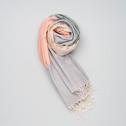 Soft, handwoven cotton scarf in pastel shades with fringe details.