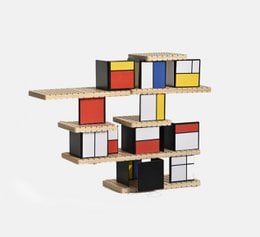 Colorful modular construction toy with wooden blocks and drawers in various shapes and colors.