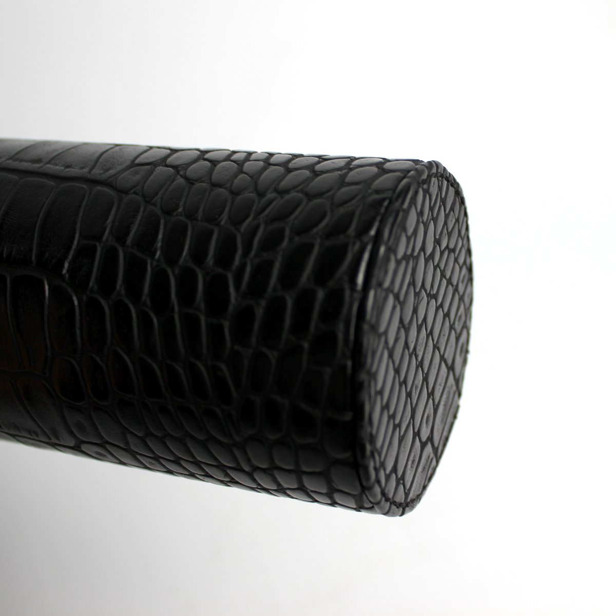 Round soap dispenser in crocodile look-black and stainless steel