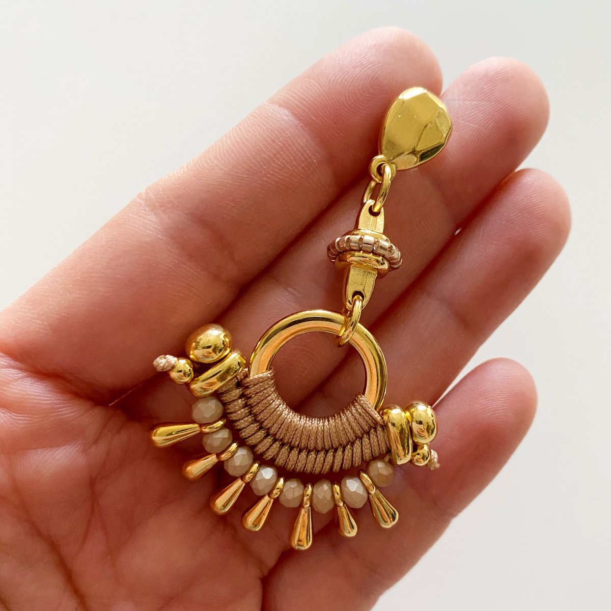TIBÚ beige and gold statement earrings