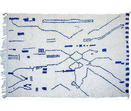 Handmade Berber carpet, a traditional woven rug with intricate blue patterns and geometric designs, suitable for use as an area rug.