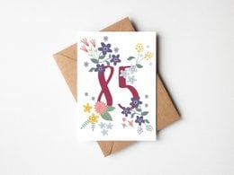 Folding card with a floral pattern in taupe and white colors, featuring the text "Congratulations" on the front. The card is suitable for birthday celebrations.