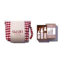 This limited edition Christmas set contains a travel-sized beauty routine, including face treatments in a red and white gingham-patterned pouch.