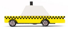 Yellow taxi toy car with black checkered pattern, elongated rectangular shape, wheels, classic taxi design.