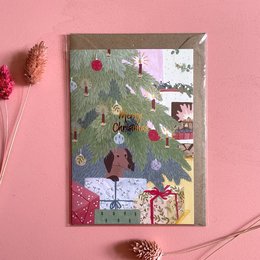 Folding Christmas card with festive tree, ornaments, and presents.