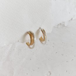 Two-tone double hoop earrings with a sleek, modern design.
