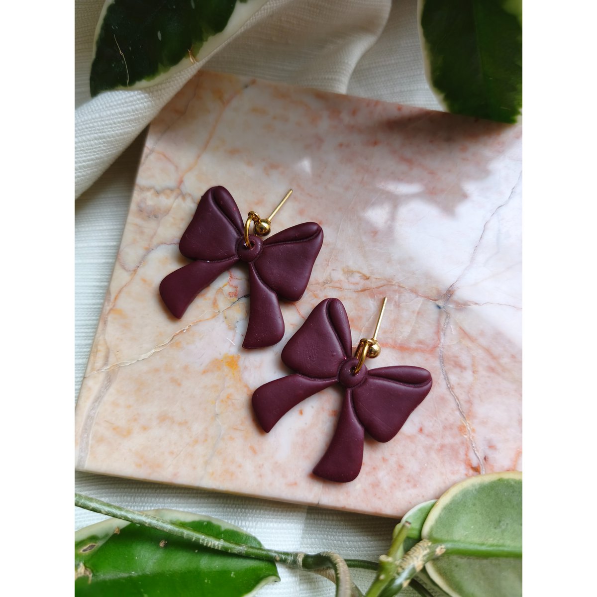 Boucles d'oreilles noeud bordeaux
