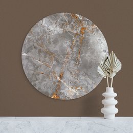 A round, gray marble wall circle with amber and gold veining. The circle is a decorative wall art piece suitable for various home decor styles.