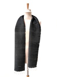 Black woven scarf with textured pattern.