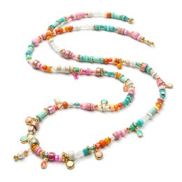 A long, colorful necklace made of beads in various shapes and shades of pink, orange, green, and turquoise. The necklace features small charms or pendants hanging from it, adding to its whimsical and playful appearance.