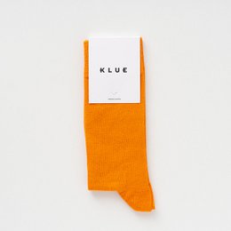  Orange organic solid socks with a simple, minimalist design. Made from high-quality materials for comfort and durability.