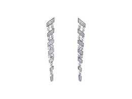Long, silver-colored drop earrings with a statement design featuring a cascading arrangement of diamond-shaped elements.
