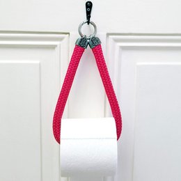Red toilet roll holder with 3D coat of arms design, made of durable material.