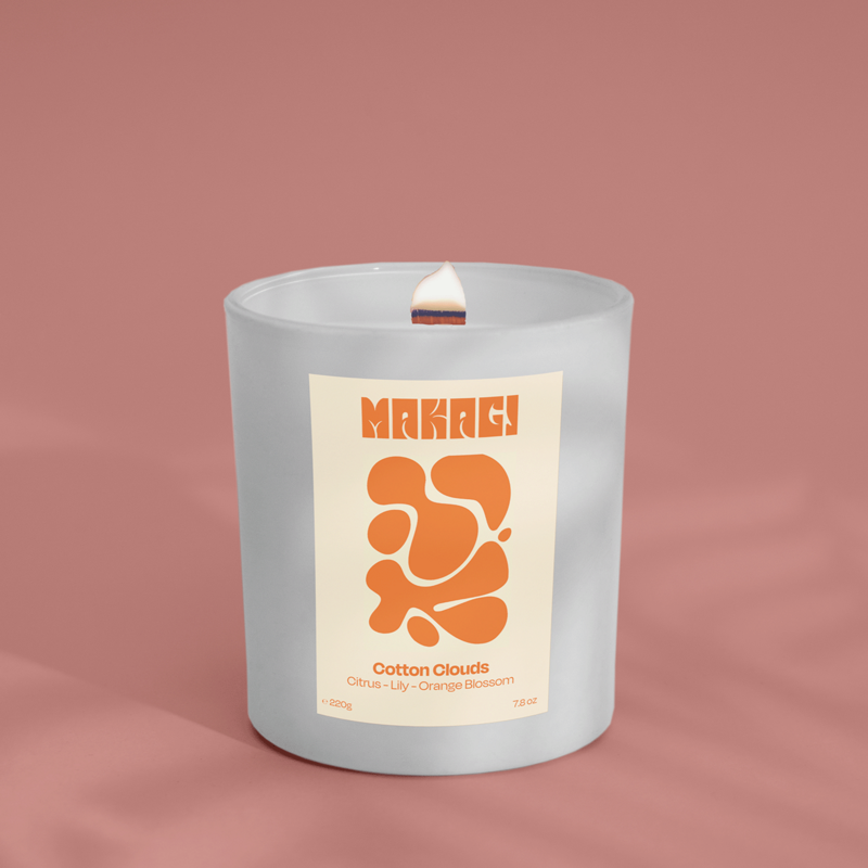 Fragrance candle in the glass of Cotton Clouds - citrus, violet & orange blossom