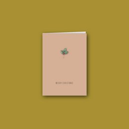 Folded Christmas card with envelope, featuring a simple star design in a light blue color.