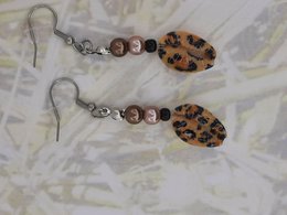%2364 OW Cowry panther shell earrings