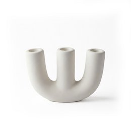 A white, modern candelabra with three tall, cylindrical candle holders. The candelabra has a simple, minimalist design and is made of a smooth, matte material.