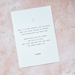 A birth announcement card featuring a simple, handwritten-style text on a light background.