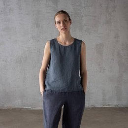 Blue linen blouse with sleeveless design, suitable for casual or formal wear.