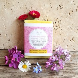 Floral hand soap with rose and lavender scents, featuring a pink and white packaging design with a botanical motif.