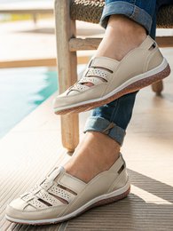 Elasticated openwork loafers in beige, gray, red, and blue colors. Slip-on style with a casual, comfortable design. Available in sizes 36-41.