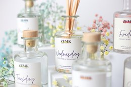 Scented candle diffuser kit with 7 fragrance options including Cassis & Fig, Grapefruit & Gardenia, Lime, Amber, Velvet Rose & Oud, Peonies & Pink Pepper, and Vanilla & White Musk.