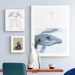 Poster featuring a minimalist illustration of whales in shades of gray and blue. The poster has a simple, abstract design that captures the essence of these majestic marine creatures.
