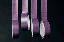 Purple decorative washi tape with a matte finish and a smooth, uniform texture.