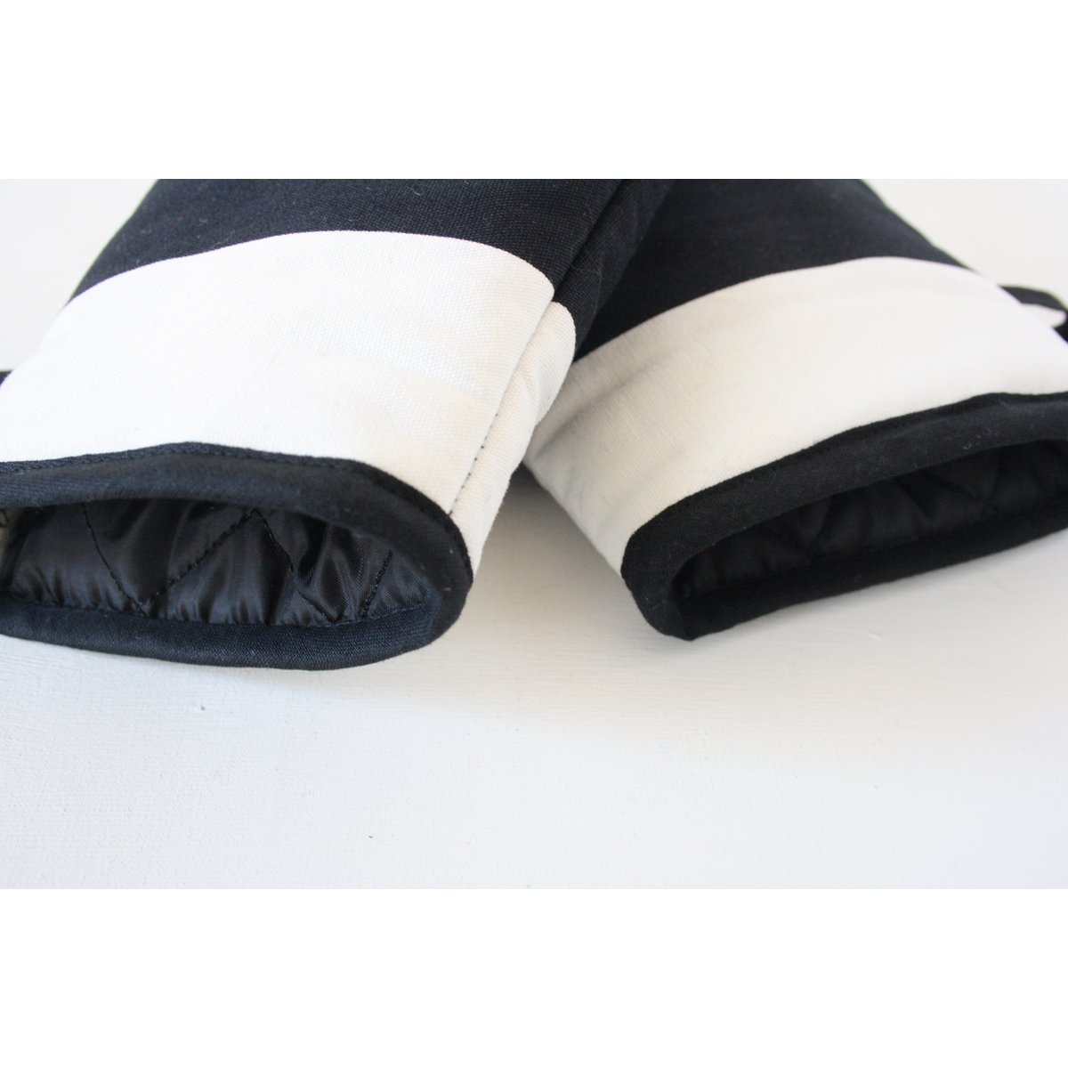 White and black striped oven gloves