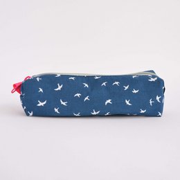 Navy blue pencil case with a repeating white bird pattern, featuring a red zipper pull.