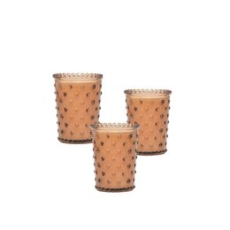  Chestnut-colored hobnail votive candle with a textured glass surface and a decorative rim.