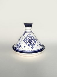 Blue and white patterned ceramic tagine pot with a conical lid.