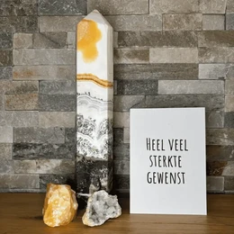 A simple greeting card with the text "Heel veel sterkte gewenst" (Wishing you lots of strength) in a handwritten-style font. The card has a minimalist design with a black star icon in the top left corner against a plain white background.
