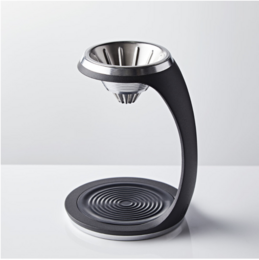A sleek, modern black coffee maker with a stainless steel filter and drip tray. Designed for efficient and stylish coffee brewing.