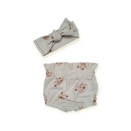  Floral print baby bloomers with matching bow headband. Soft, lightweight fabric in a neutral gray color. Comfortable and stylish baby bottoms with a bow accent.