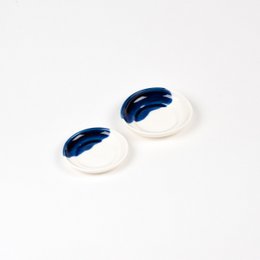 Ceramic mini saucer in various colors including blue, green, ochre, pink, and lilac. Circular shape with a simple, minimalist design.