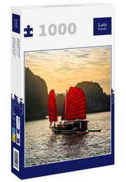 A 1000-piece puzzle depicting traditional Vietnamese junk boats sailing on the scenic Ha Long Bay at sunset. The image showcases the iconic red sails of the boats against the dramatic limestone cliffs and vibrant sky.