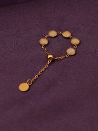  Gold-plated adjustable ring with round stone details, chain design, elegant statement piece.