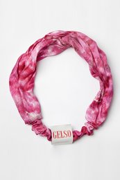 Bright pink 100% silk hair band with a tie-dye pattern.